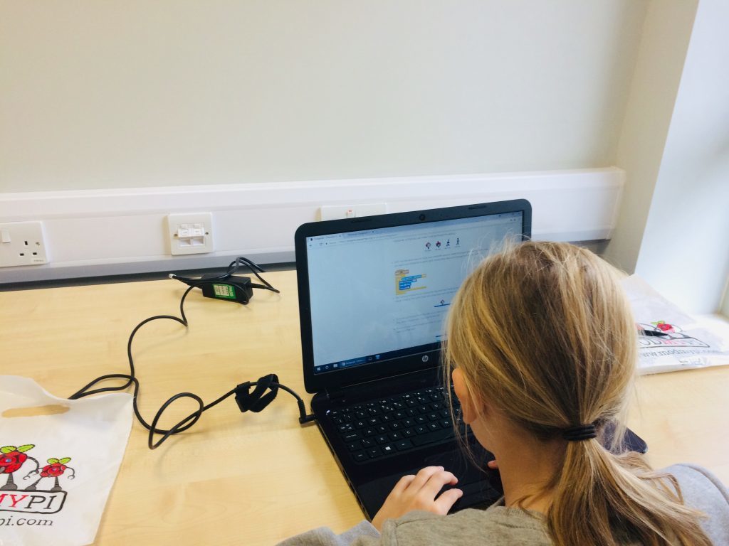 Photo of girl learning to code in Scratch