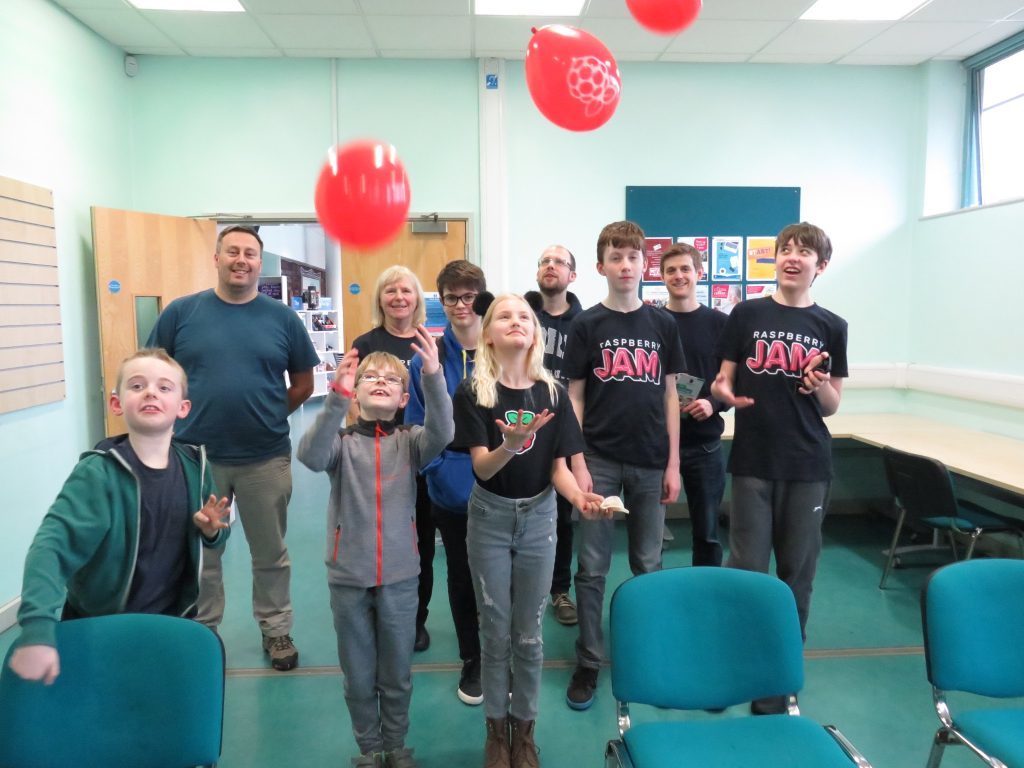 Group of people with balloons attending York Pi Jam